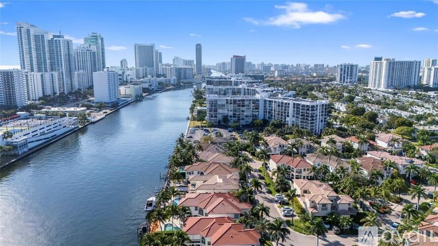 A cityscape with a river running through it.