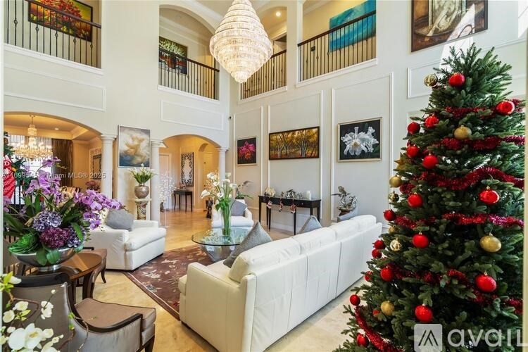 A Christmas tree is decorated with ornaments and placed in a living room.