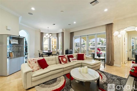 A living room with a white couch and a coffee table.