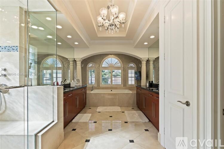 A spacious bathroom with a walk-in shower and a large mirror.