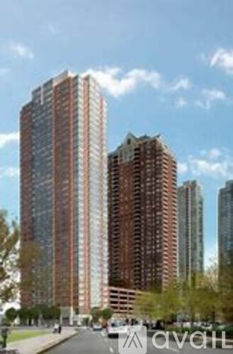 A tall building with a lot of windows is in the foreground.