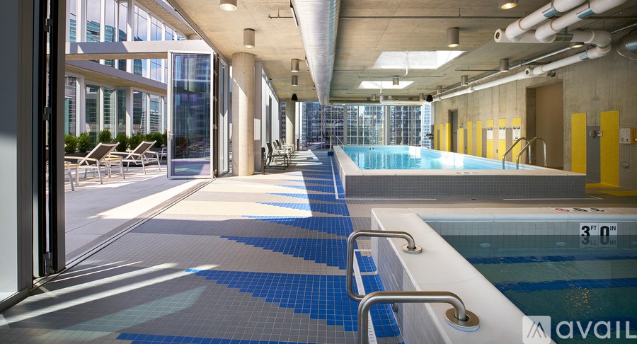 A swimming pool with a blue tiled edge and a white edge.