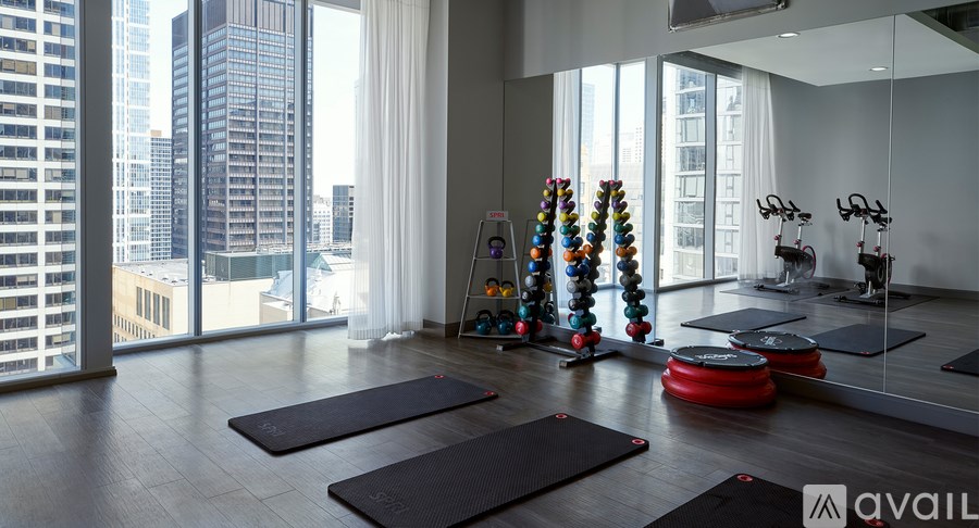 A yoga studio with mats and exercise equipment.