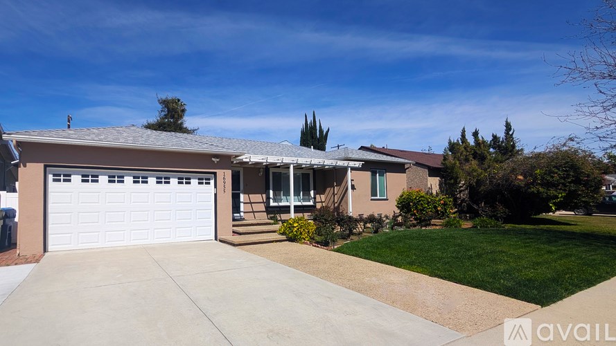 A house with a garage is for sale.