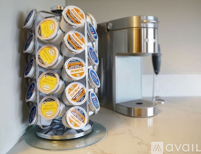A container of yogurt is on a kitchen counter.