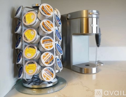 A container of yogurt is on a kitchen counter.