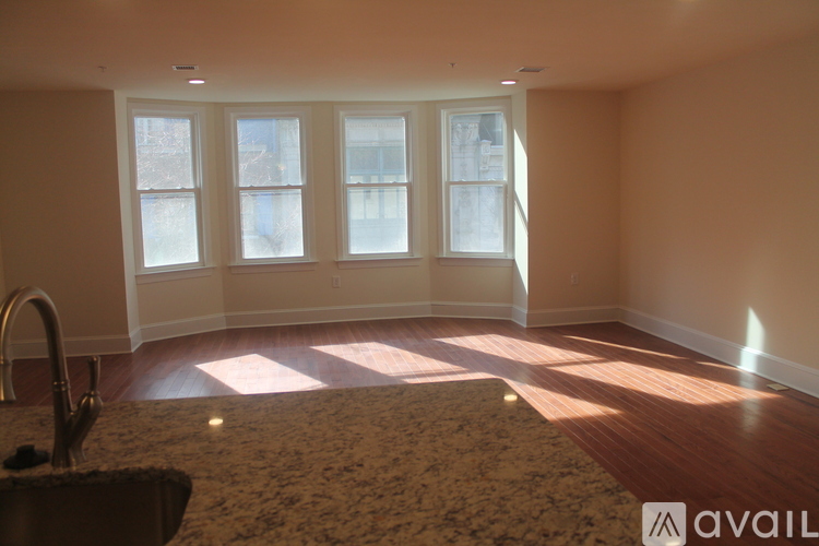 A kitchen with a sink and a window.