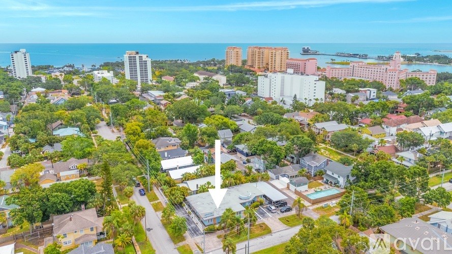 A bird's eye view of a residential area with a road running through it.