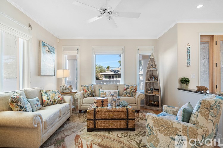 A living room with a sofa, armchair, and a coffee table.