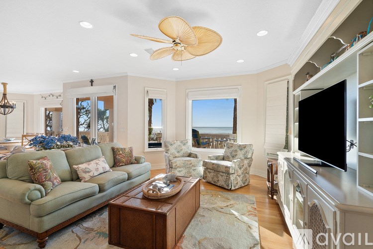 A living room with a green couch and a wooden coffee table.