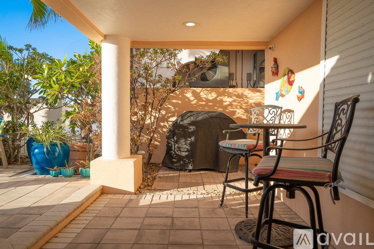 A patio with a table and chairs is available for rent.