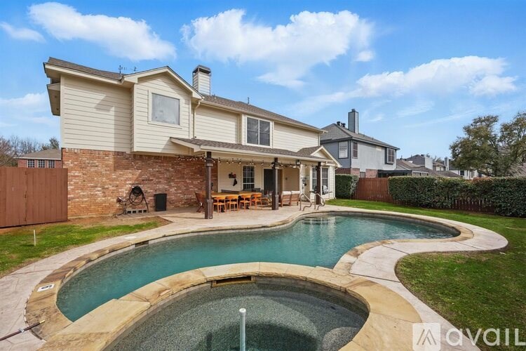 A house with a pool in the backyard.