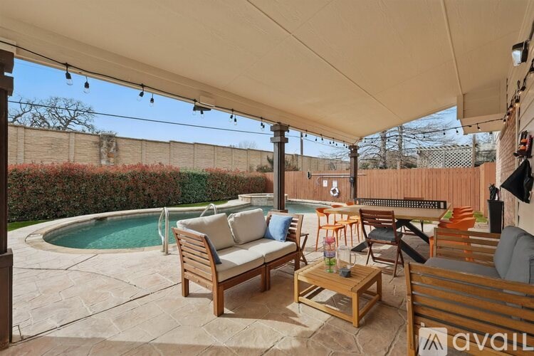 A patio with a pool and furniture is available for rent.