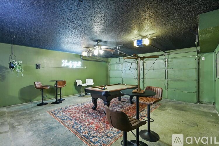 A room with a table and chairs in it.