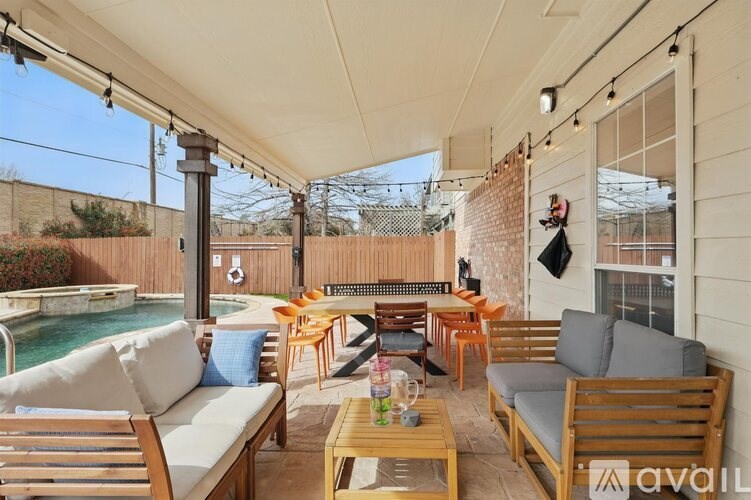 A patio with a table and chairs is available for rent.