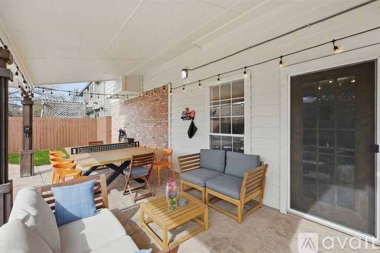A patio with a table and chairs is shown.