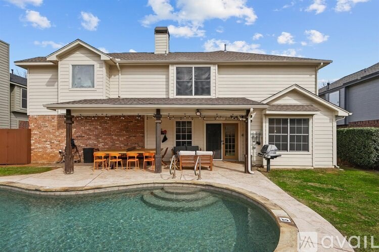 A house with a pool in the backyard.