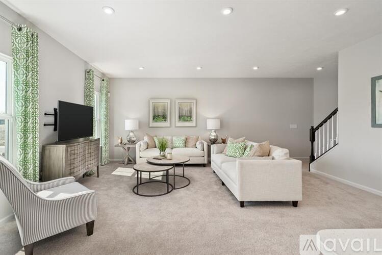 A living room with a television, sofa, and coffee table.