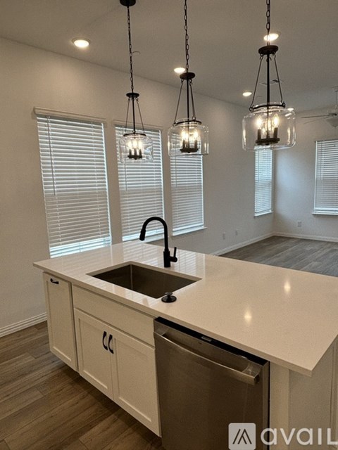 A kitchen with a sink and a countertop.