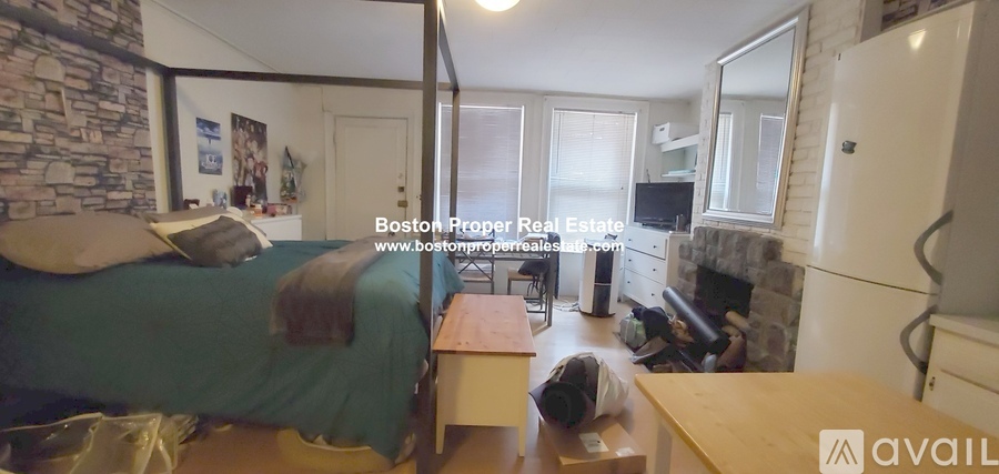 A man is sitting on the floor in a living room.