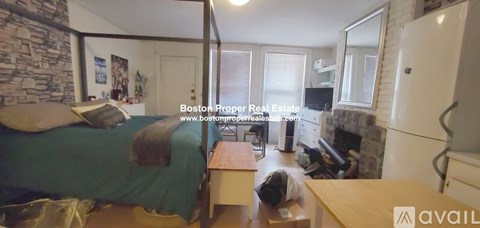 A man is sitting on the floor in a living room.