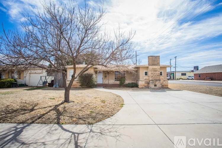 A house with a tree in the front yard is for sale.