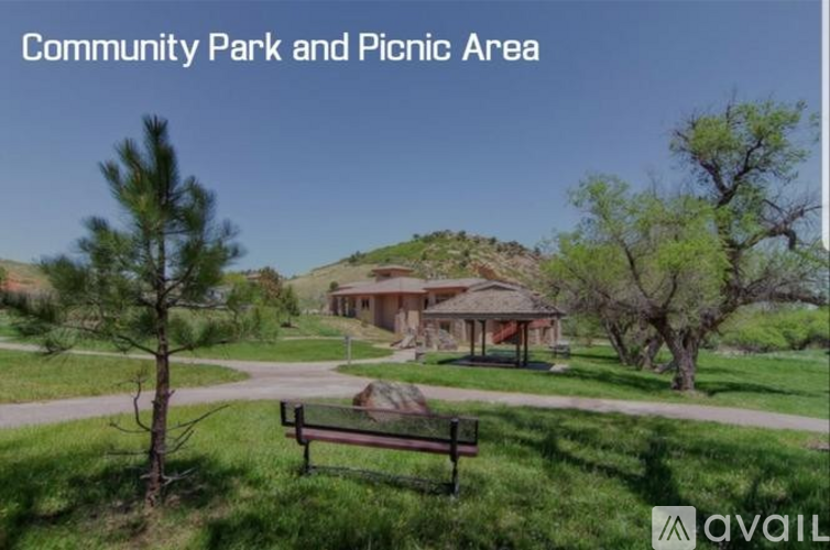 A community park and picnic area with a pavilion and benches.