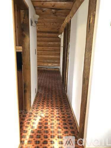 A field of flowers with sunflowers and bluebells.