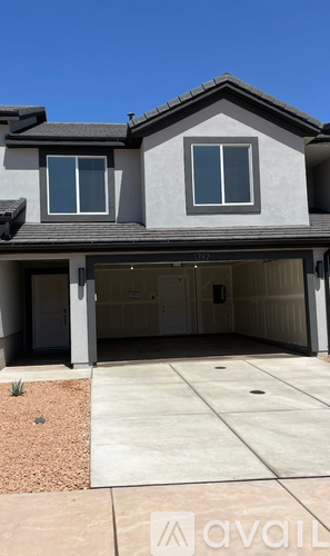A house with a garage and a driveway.