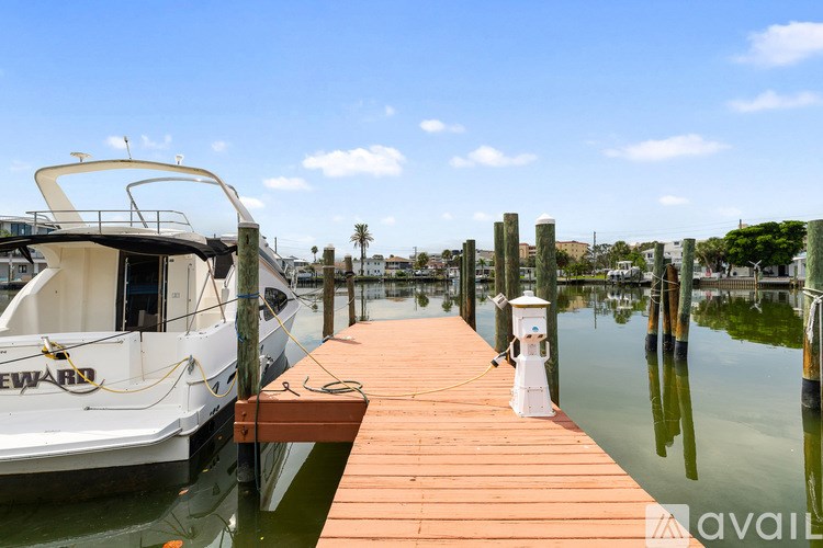 A boat is docked at a wooden pier.
