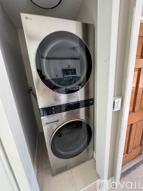 A LG front loading washing machine with the door open.