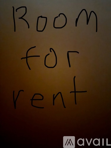 A sign that says "Room for rent" is displayed.