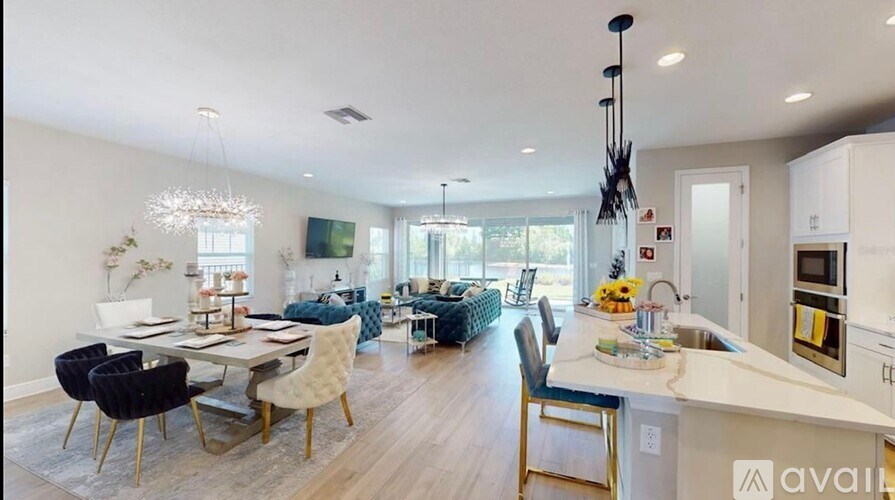 A modern kitchen with a dining table and chairs.