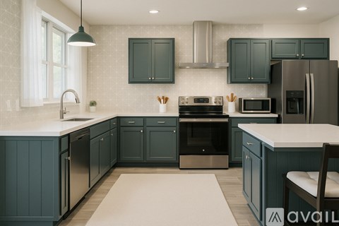A kitchen with dark green cabinets and stainless steel appliances.