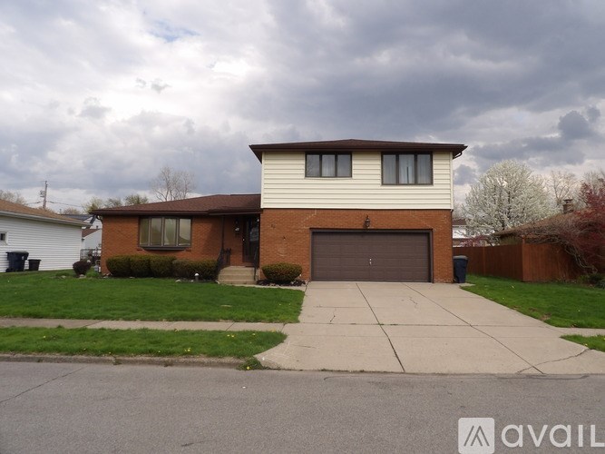 A house with a garage is available for sale.