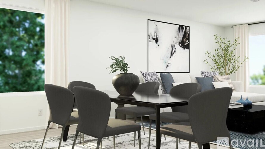 A modern dining room with a large table and chairs.
