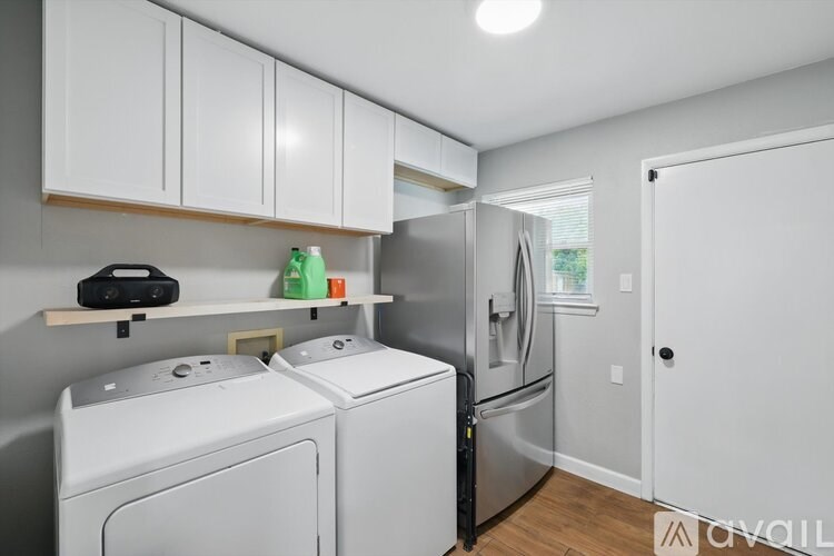 A laundry room with a washer and dryer.