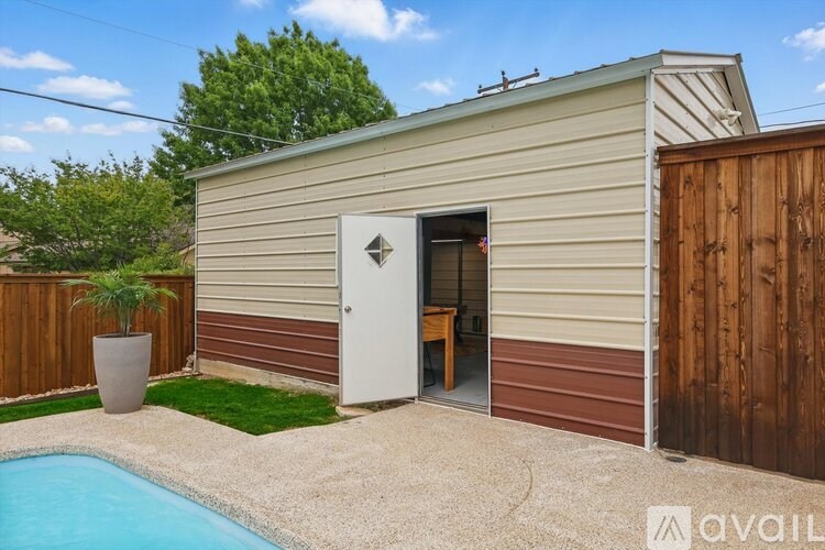 A small house with a pool in the backyard.