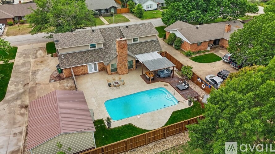 A house with a pool in the backyard.
