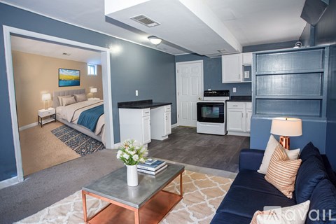 A living room with a grey couch and a coffee table.