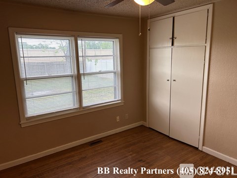 A room with a BB Realty Partners sign on the wall.