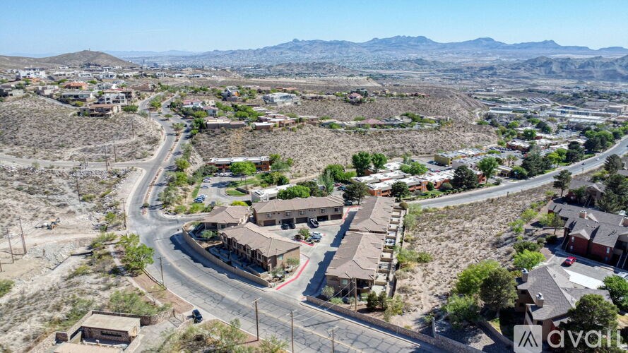 A bird's eye view of a residential area with houses and roads.