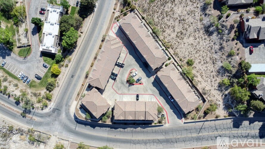 A bird's eye view of a residential area with houses and a street.