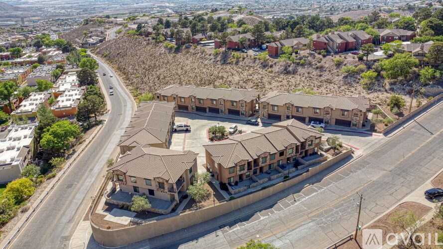 A bird's eye view of a residential area with houses and roads.