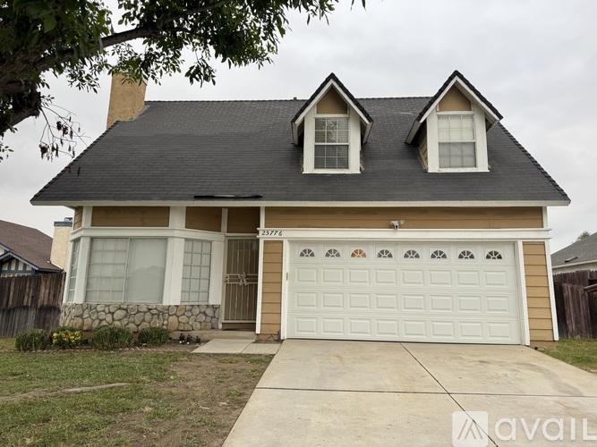 A house with a garage door that says "AVAIL" on it.
