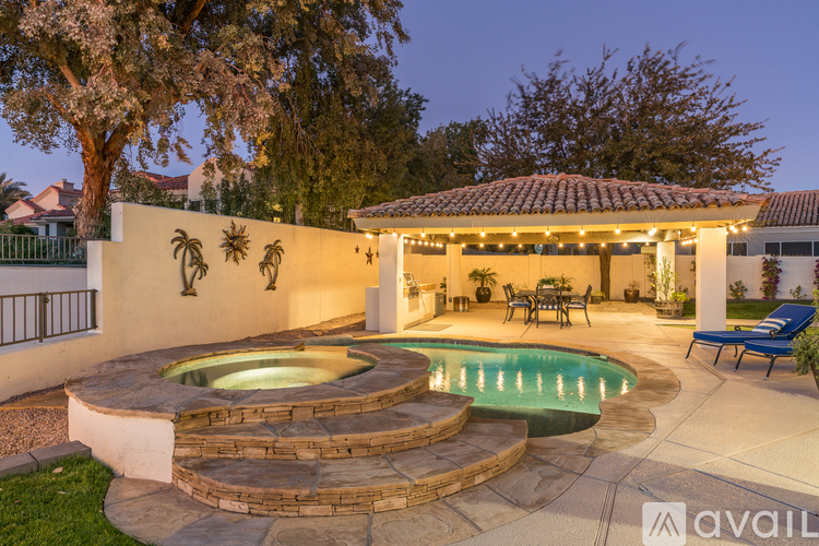 A house with a pool and a patio area.