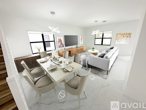 A modern living room with a dining table set for four.