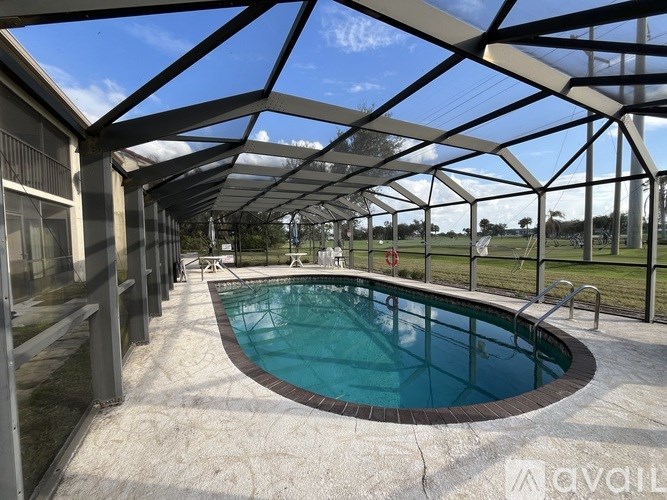 A pool under a glass roof.