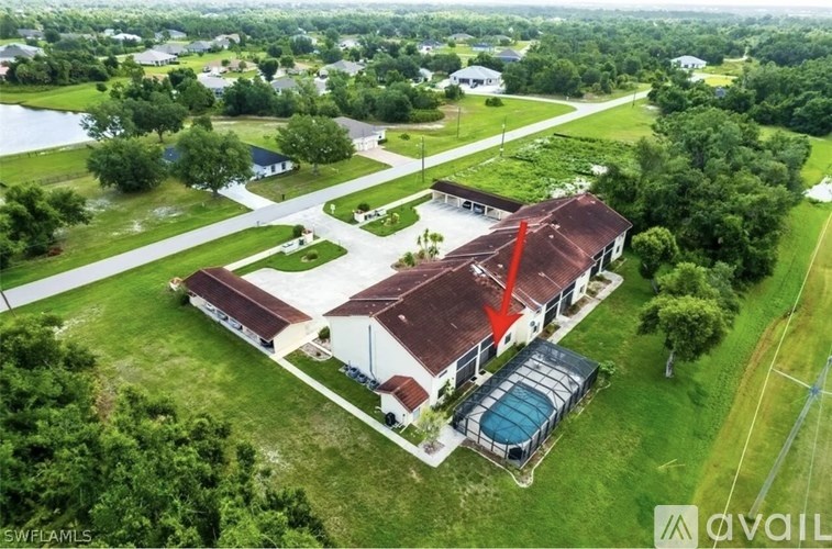 A house with a red arrow pointing to the roof.
