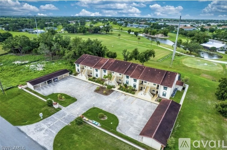 A large house with a driveway in front of it.